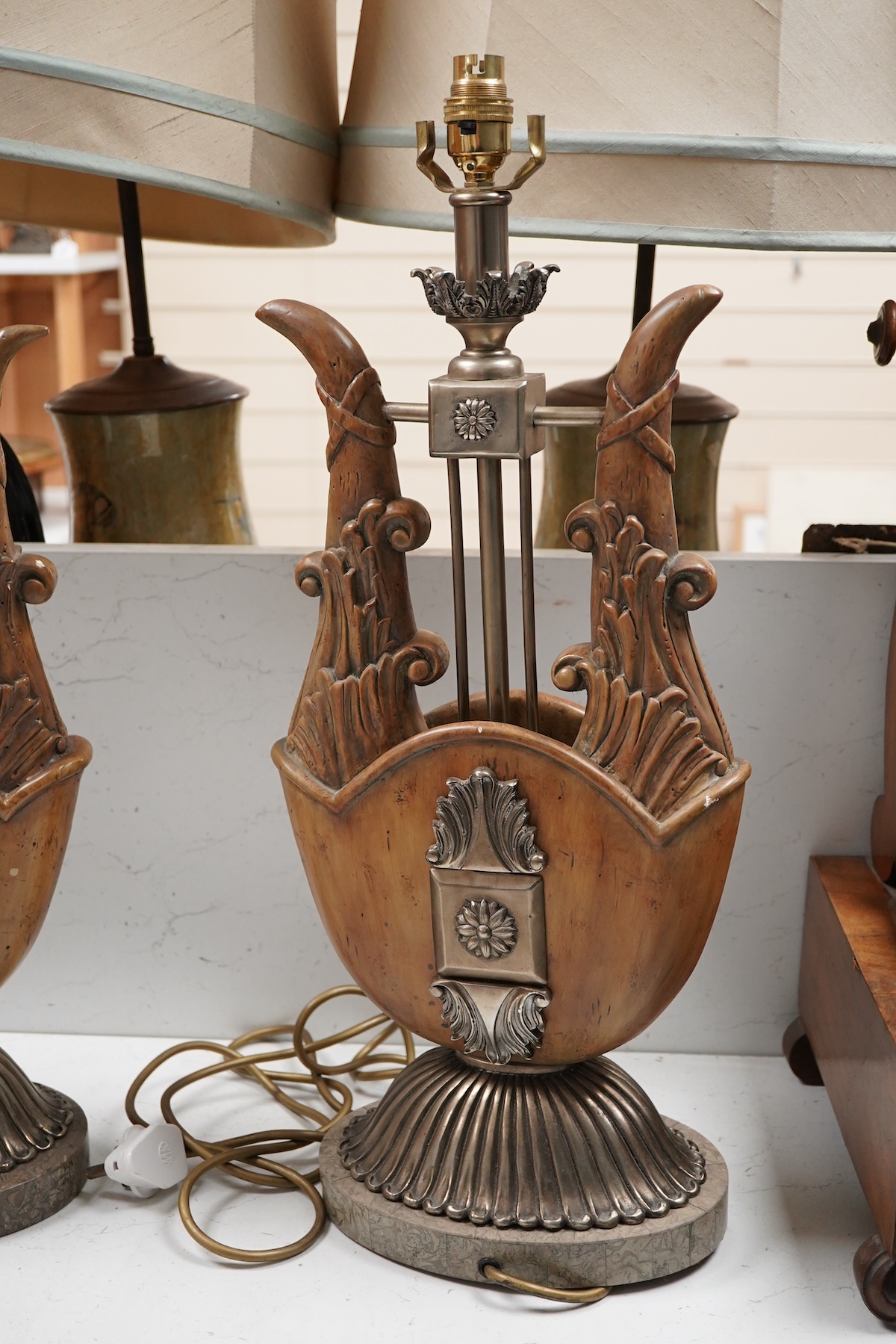 A pair of Maitland-Smith lyre shaped tablelamps